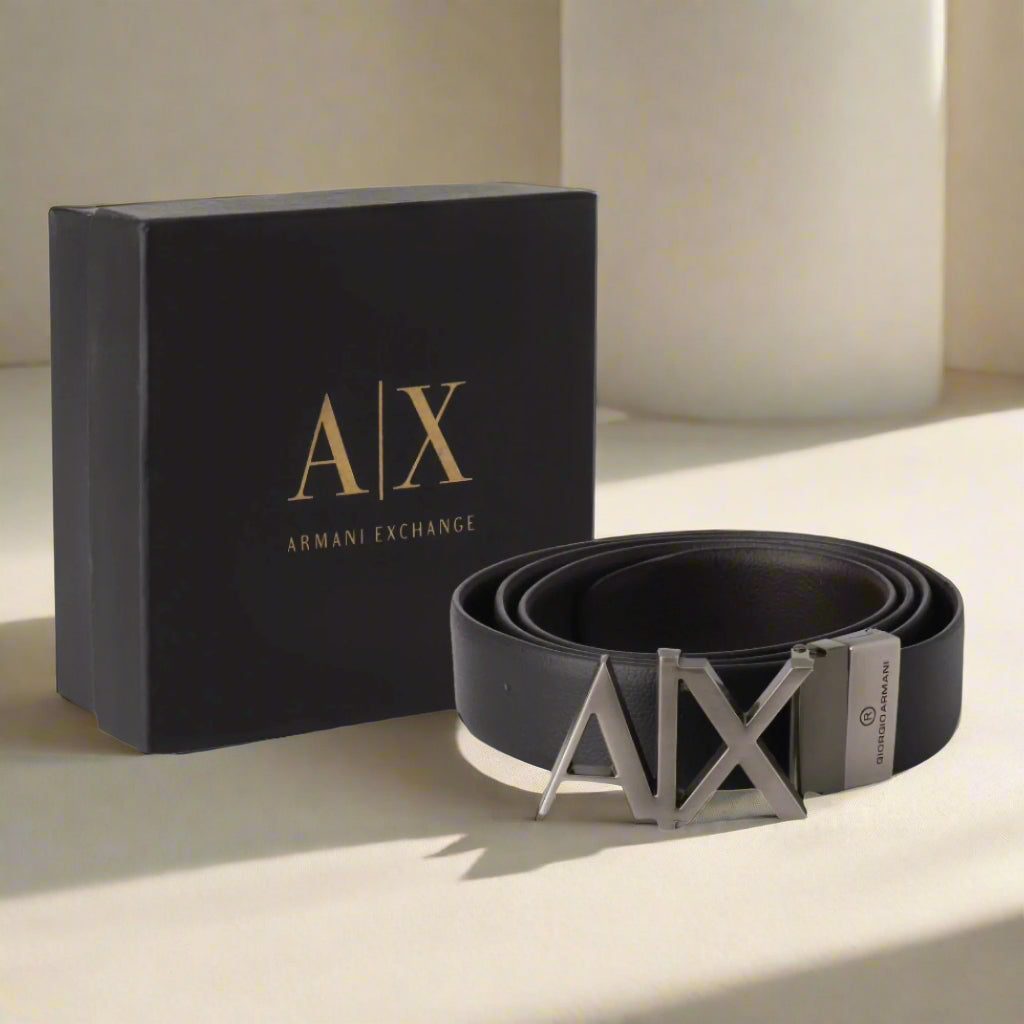 Black Armani Exchange belt with logo and packaging on a white background