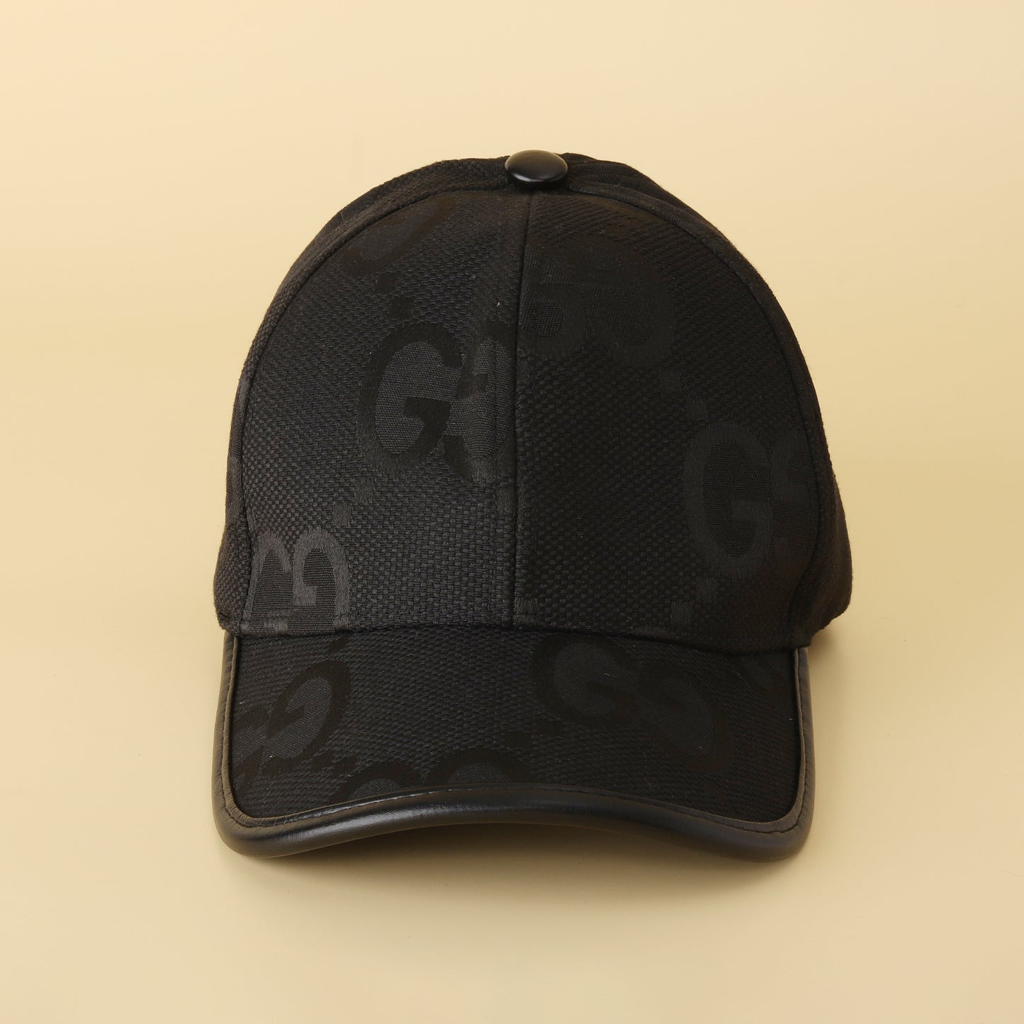 Sleek Black 'GG' Pattern Cap - Textured Design & Faux Leather Brim