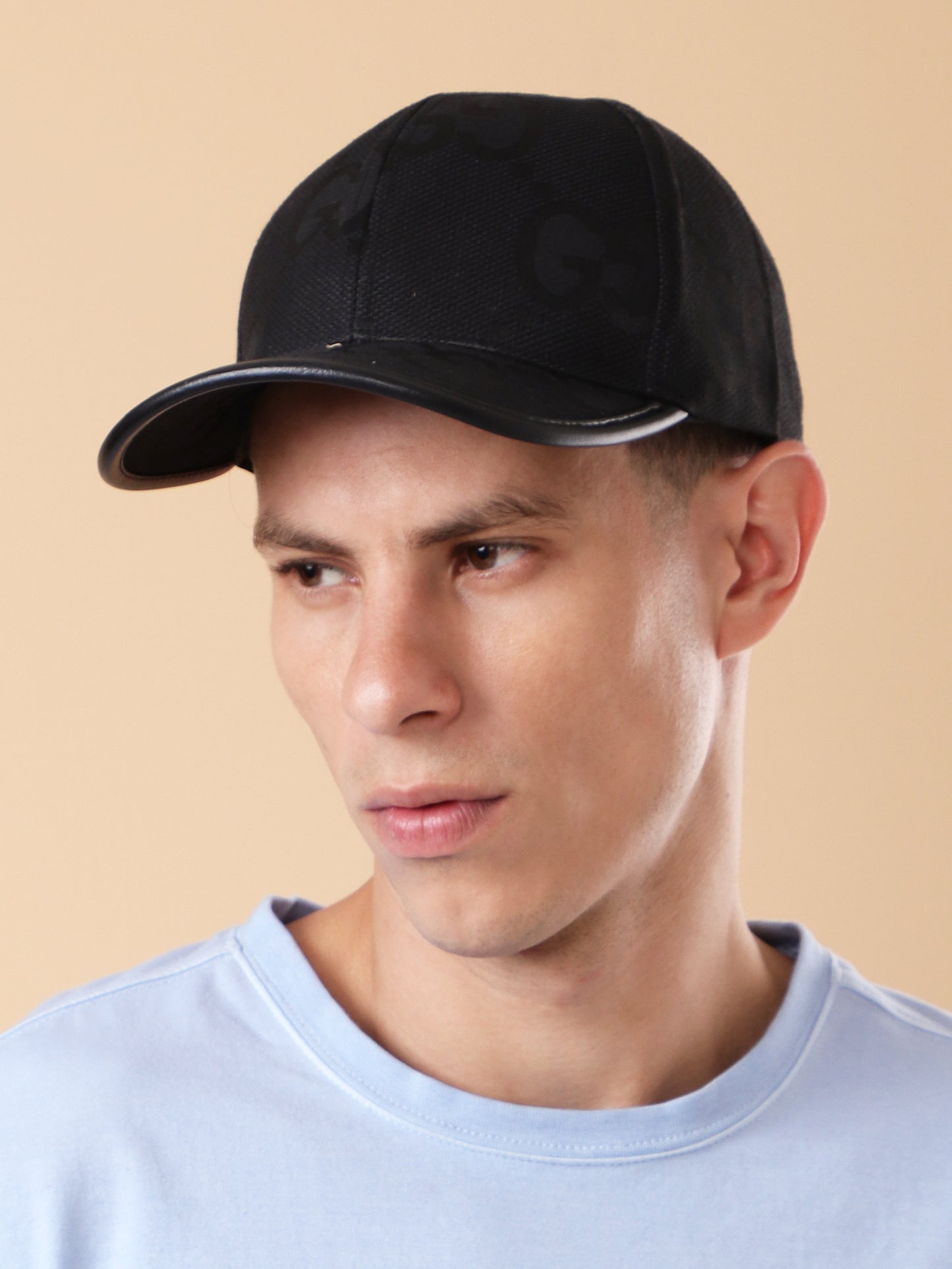 Sleek Black 'GG' Pattern Cap - Textured Design & Faux Leather Brim