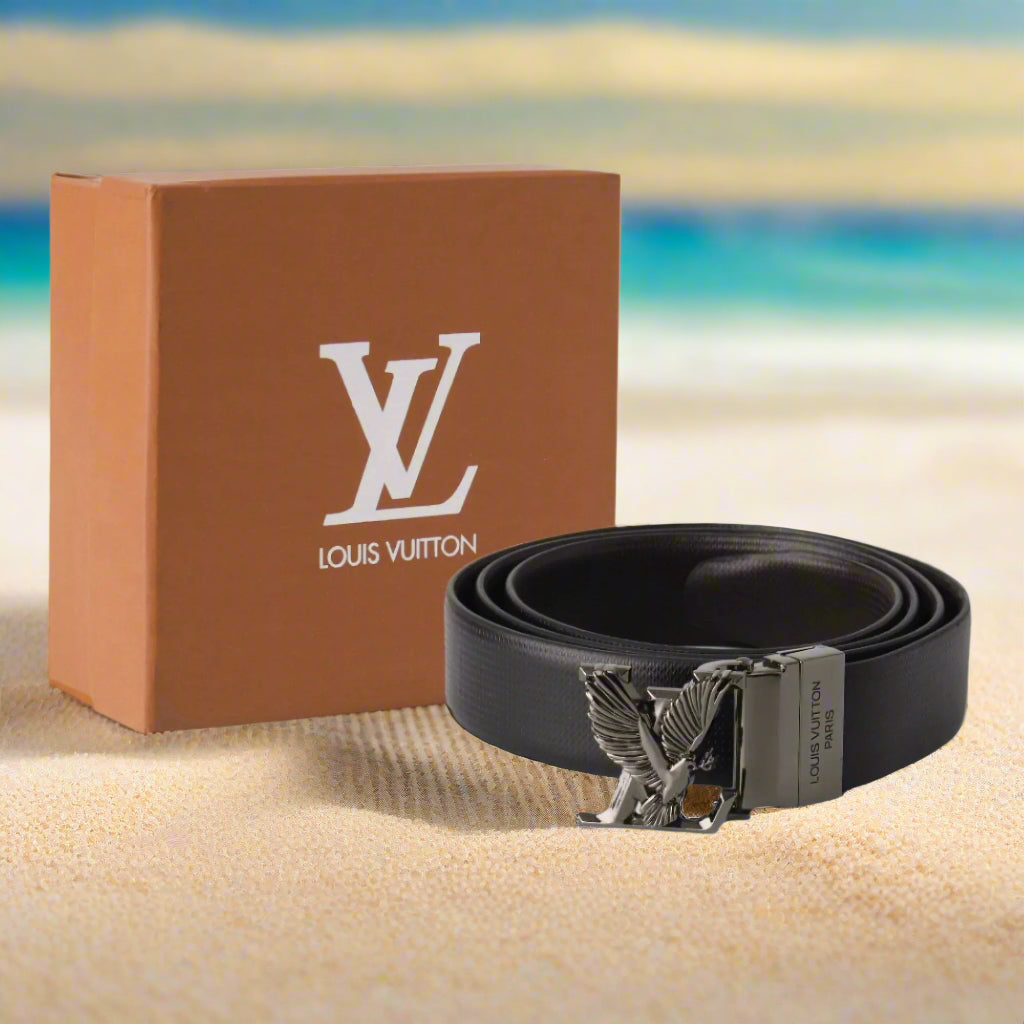 Louis Vuitton black belt with silver buckle next to a brown box on a white background